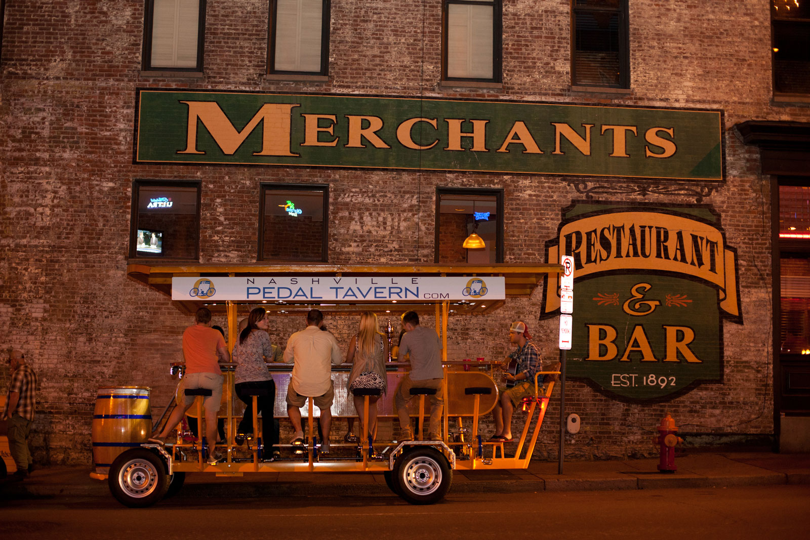 Pedal Tavern boat in front of Merchants Restaurant & Bar - nashville tourist attractions, nashville attractions, nashville activities