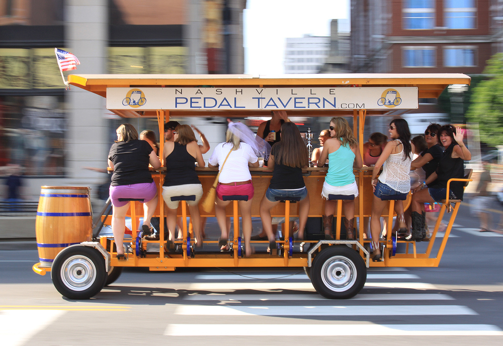Bachelorette party riding the pedal tavern boat into downtown Nashville - nashville bachelorette party, bachelorette party ideas