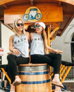 Girls repping The Nash Collection t-shirts on the Pedal Tavern party bike