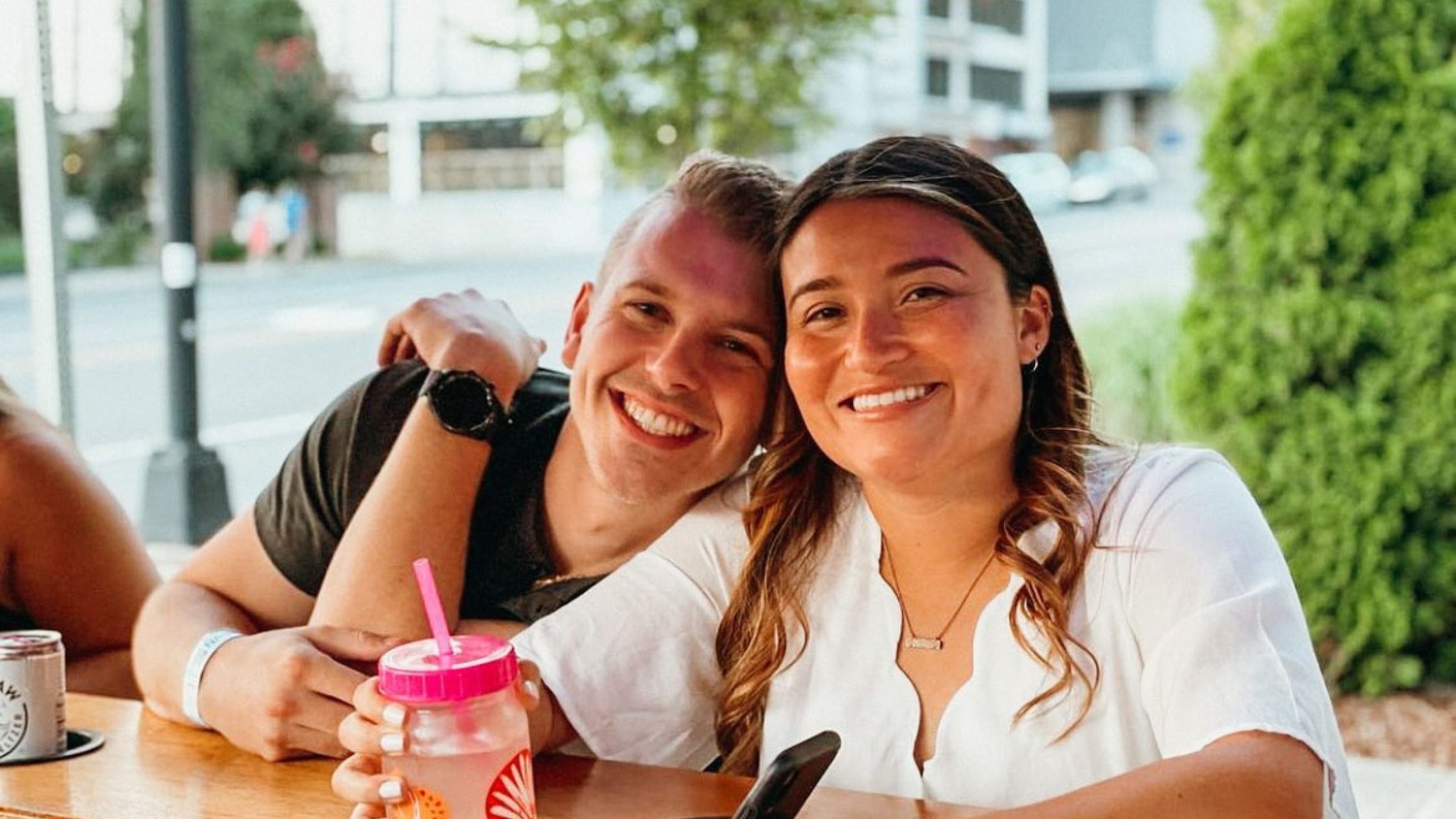 Couple smiling on bike bar date in nashville