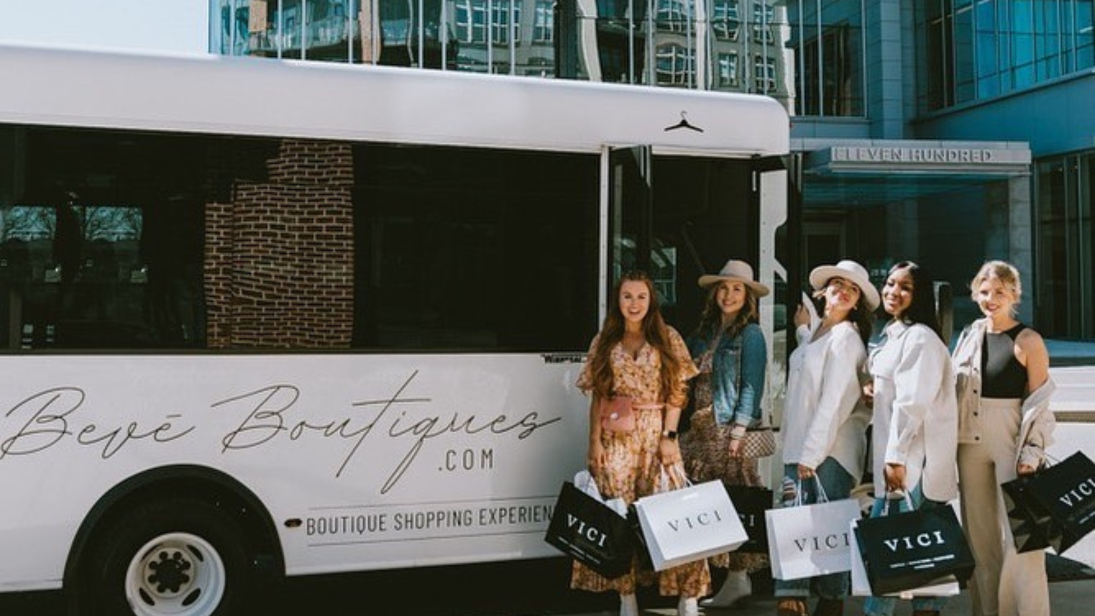 women in front of a Beve Boutiques vehicle to get around Nashville while shopping