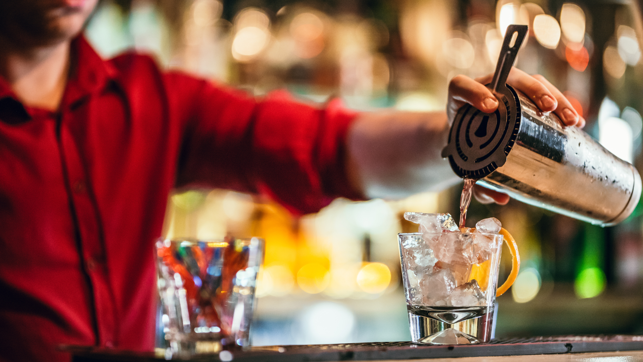 bartender serving beverages at happy hour in nashville