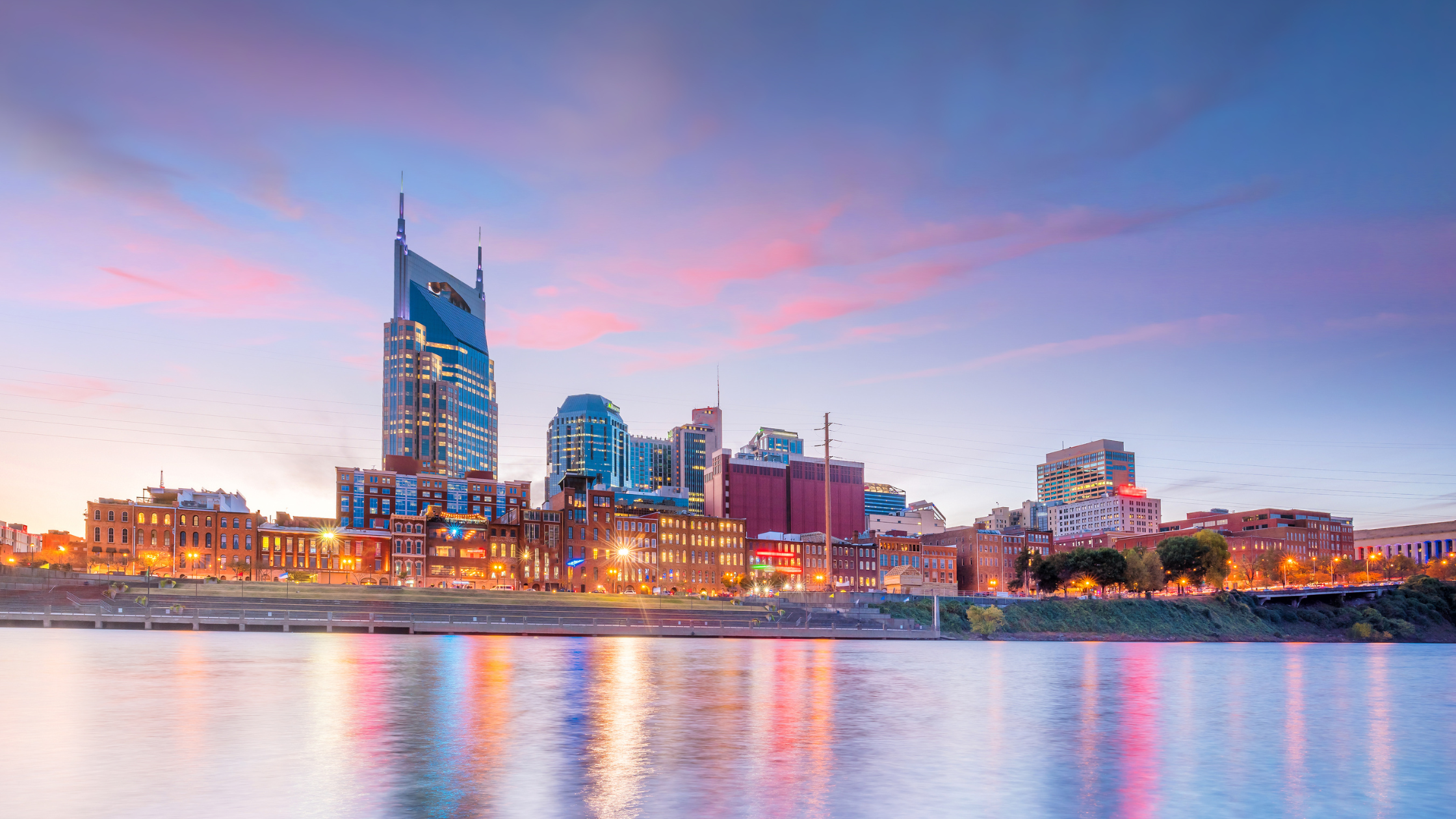 view of downtown nashville at sunset from the cumberland river