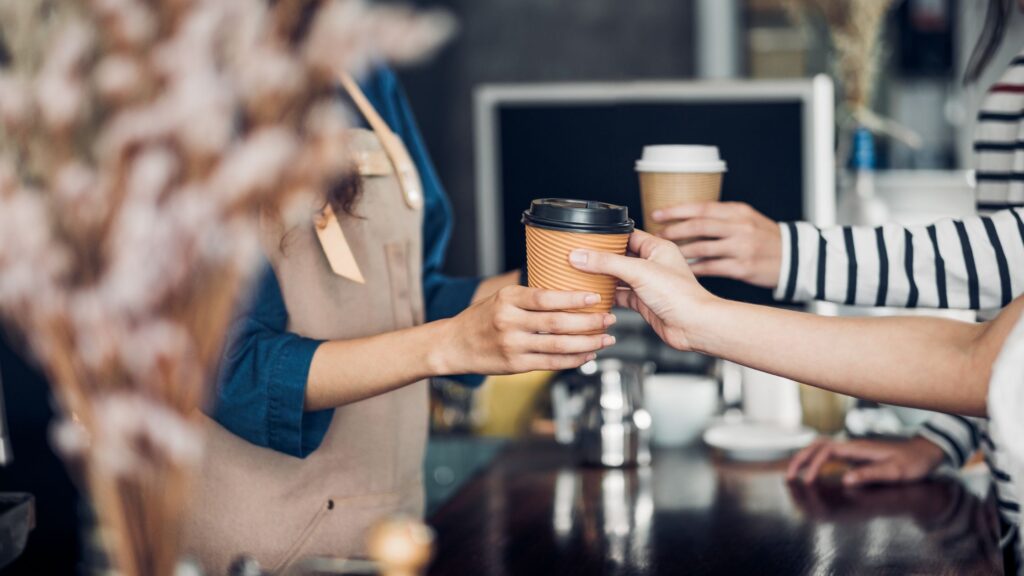two people buying coffee