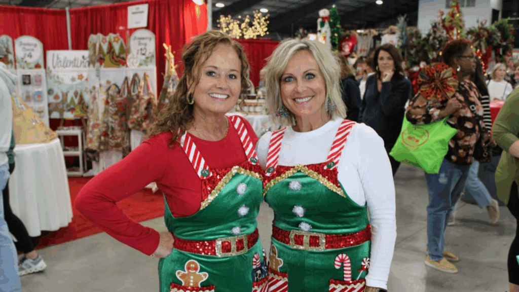 two women in christmas outfits at a holiday event in nashville