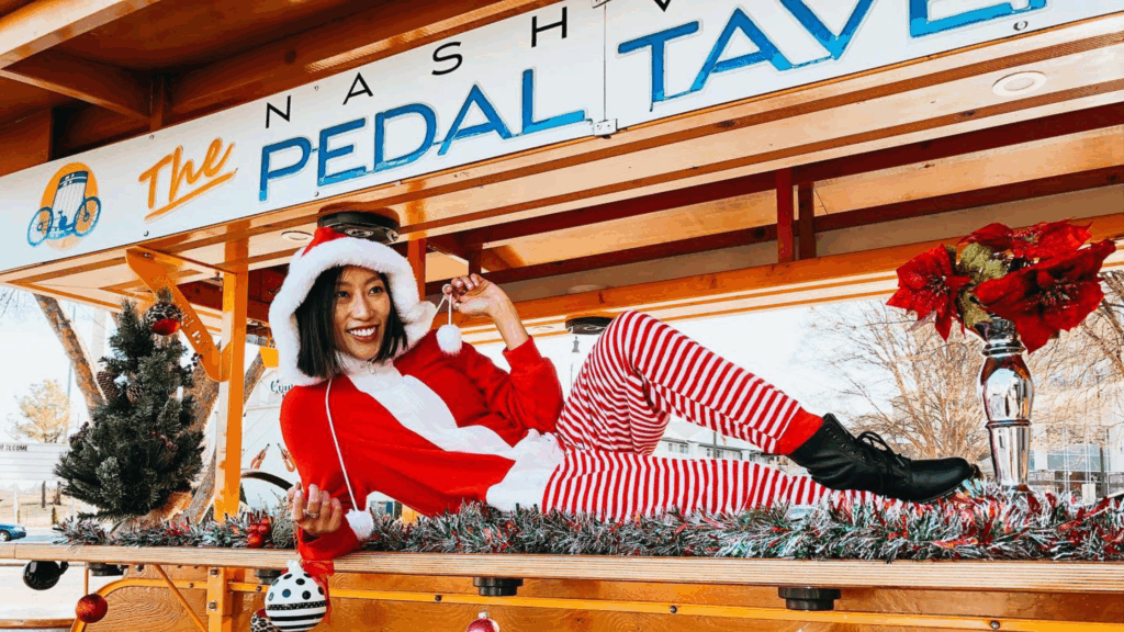 person dressed in christmas attire on a nashville pedal tavern bike